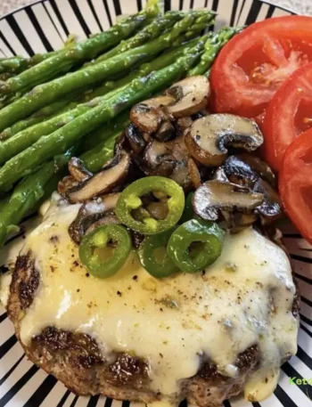 Low-Carb Burger Patty Topped with Melted Cheese, Sautéed Mushrooms, and Jalapeño Slices