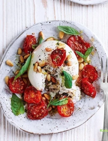 Burrata with sticky roasted tomatoes, pine nuts and basil